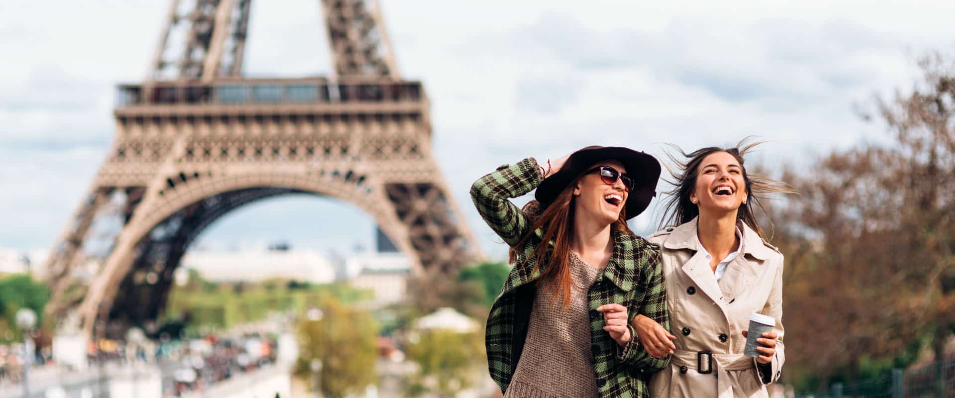 beautiful smiling girls at the eiffel tower in paris
